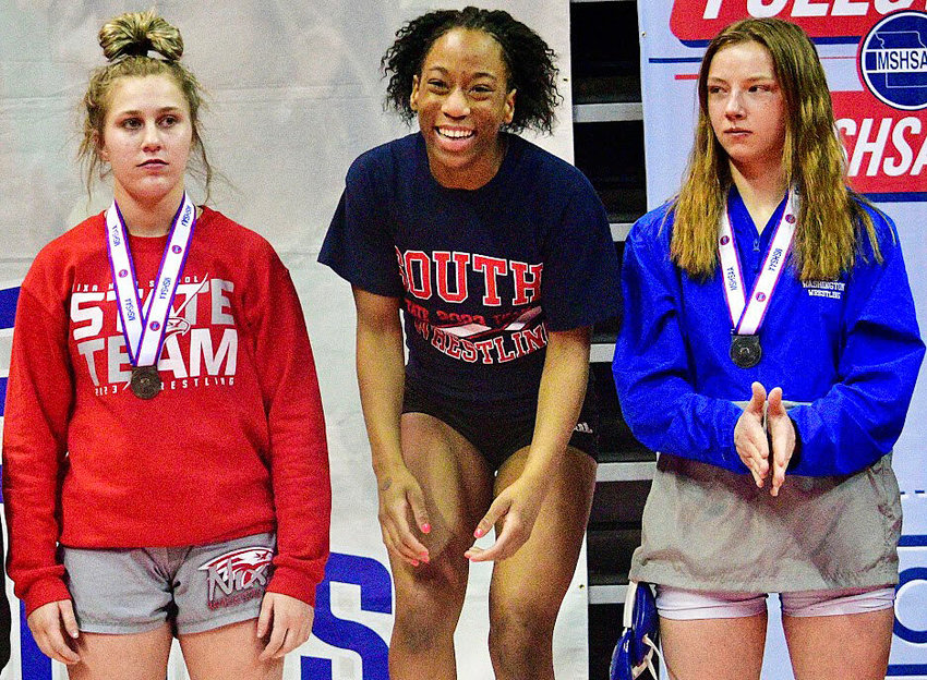 NIXA'S BRENYA CRAHAN, left, poses at the podium with other Class 4 135-pound medalists.