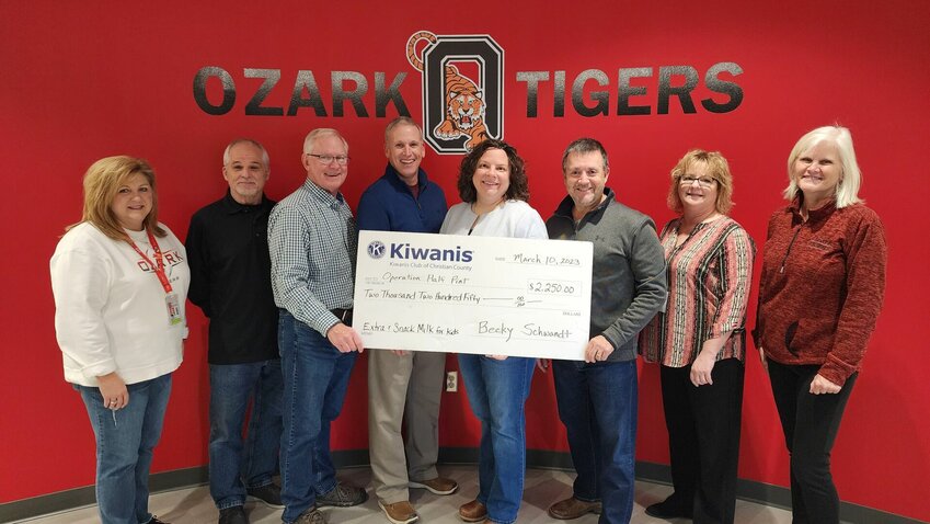 Pictured from left: Ozark Executive Director of Student Services Dr. Kim Fitzpatrick, Operation Half Pint board members Frank Lorenz and Scott Turner, Kiwanis members Ronnie Shivler, Becky Schwandt and Shane Strahl, who also serves on the Operation Half Pint Board, Ozark Nutrition Services Director Cheryl Johnson and Ozark Schools Community Resource Coordinator Rinda Monroe.
