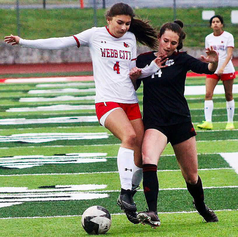 OZARK'S BROOKLYN SCHULTE battles for possession of the ball in a regular-season match.