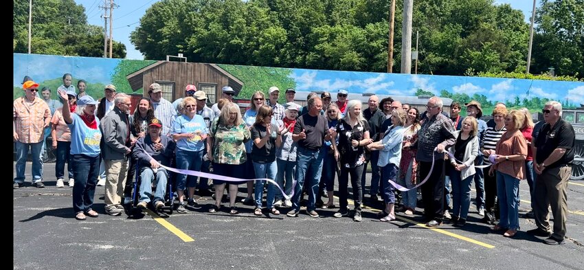 A ribbon cutting was held in front of the Chadwick Flyer Trail mural in the Ozark Senior Center parking lot on Saturday, May 20, 2023.