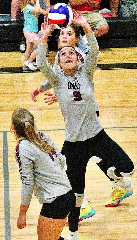 SPOKANE'S SYDNEY BRYAN eyes an assist during the Lady Owls' win at Sparta on Tuesday.