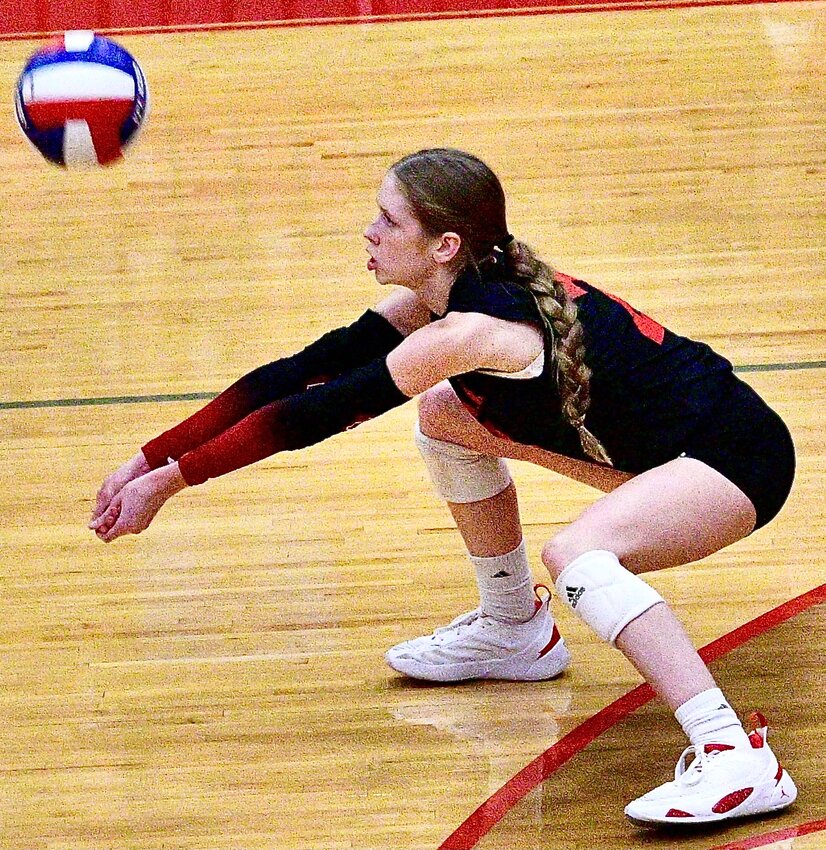 OZARK'S MACY HUMBLE gets set to make a pass from her libero position.