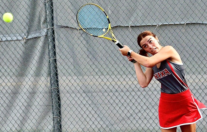 NIXA'S ABBY FULNECKY follows through on a backhand against Ozark on Tuesday.