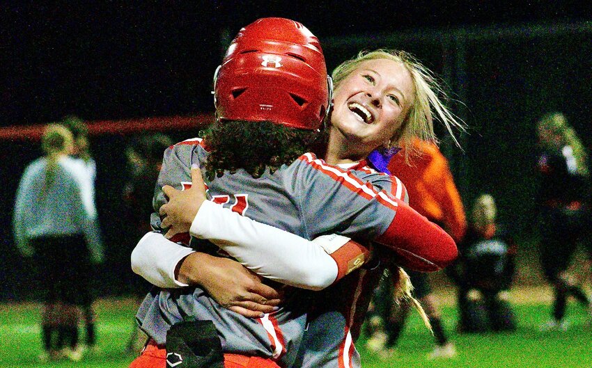 NIXA'S JORDAN PHILLIPS AND RYLEE HARPER celebrate the Lady Eagles' 5-4 Class 5 District 5 semifinal victory Saturday.