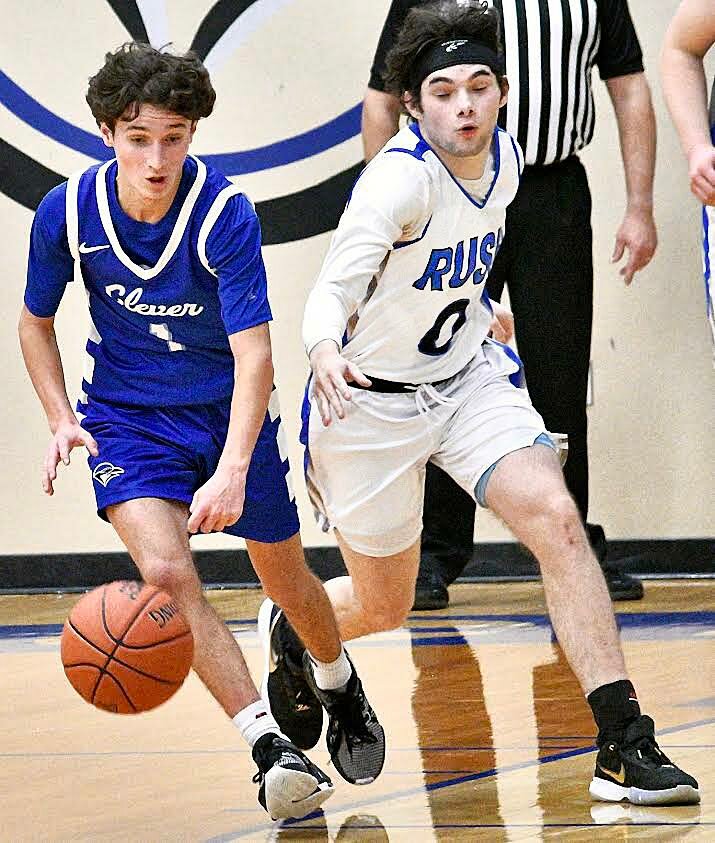 CLEVER'S BRAYDEN VERCH dribbles against pressure from a Rush defender Monday.