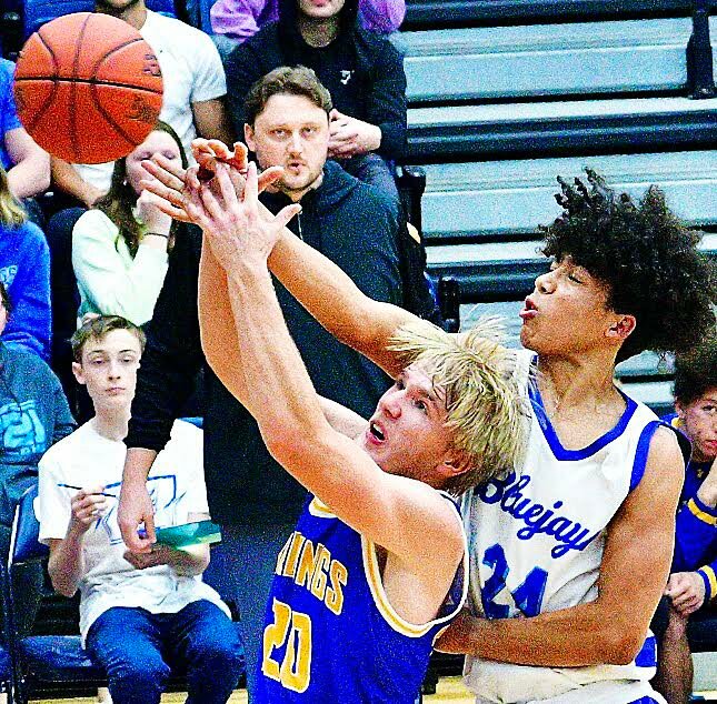 BILLINGS' DYLAN EDWARDS AND CLEVER'S ELI BUSSARD both reach for a rebound Friday.