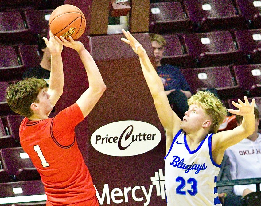 OZARK'S JACE WHATLEY shoots for two of his 11 points Tuesday.