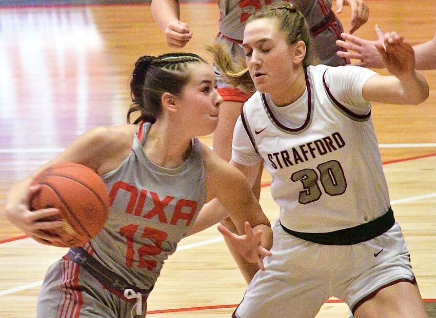 NIXA'S SADIE CONWAY makes a move to the bucket against Strafford at the Pink &amp; White Tournament on Thursday.