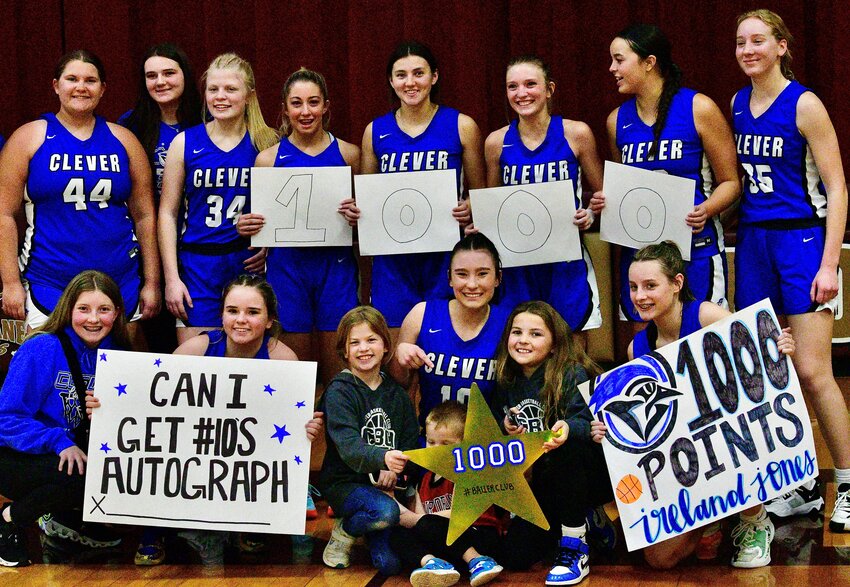 CLEVER'S IRELAND JONES poses with her teammates after reaching the 1,000-point milestone Thursday.