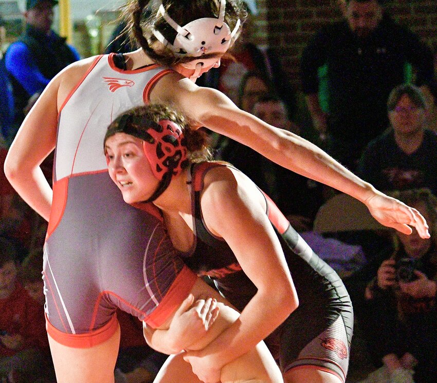 OZARK'S MAELYNN SUNDLIE goes for a takedown during her win at 135 pounds.