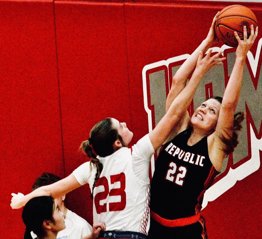 NIXA'S BROOKE TETER battles with a Republic player for a rebound Friday.