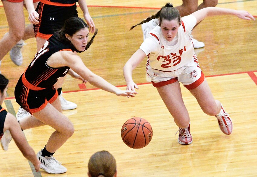 NIXA'S BROOKE TETER give chase to a loose ball.