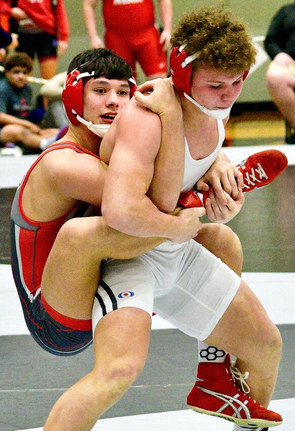 NIXA'S CURTIS GLOSSIP grabs a hold of his opponent at the COC Tournament.