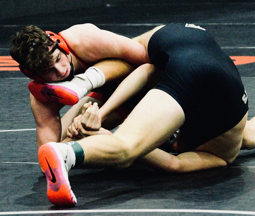 OZARK'S JOHNNY WILLIAMS tries to roll over an opponent at the COC Tournament.