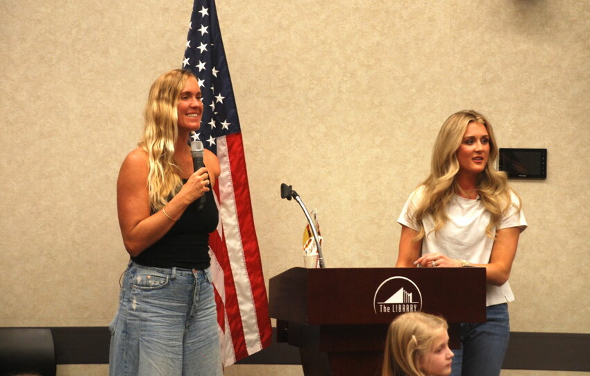 Bethany Hamilton (left) and Riley Gaines held a children's story hour at The Library Center on Feb. 2.