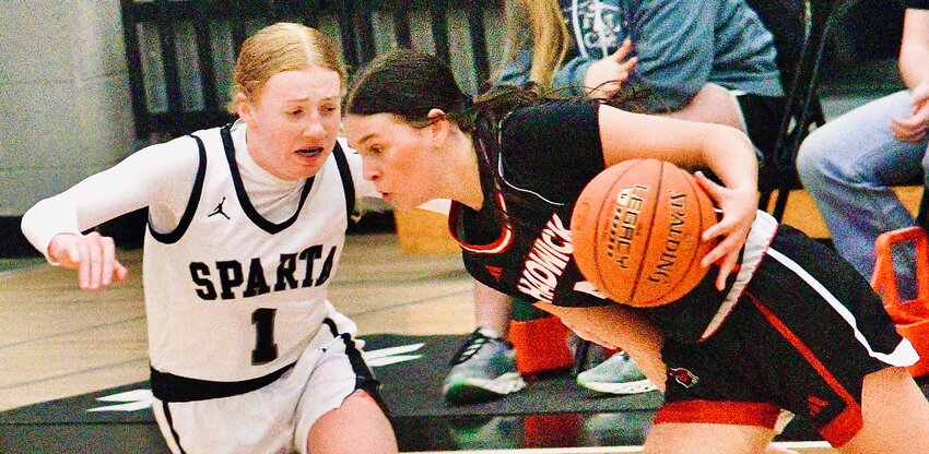 CADWICK'S KERRIGAN GUERIN tries to find room around Sparta's Mya Fulton on Wednesday.