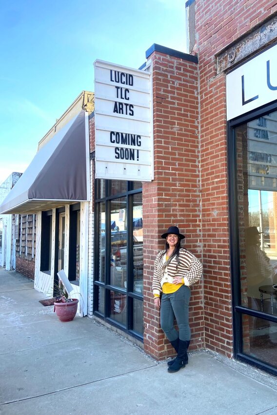 Tiffany Collins, owner of Lucid TLC Arts, stands in front of her art gallery’s new location at 111 South Main St., Nixa.