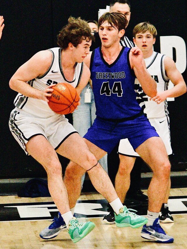SPARTA'S JAKE LAFFERTY meets up with a Greenwood defender Thursday.