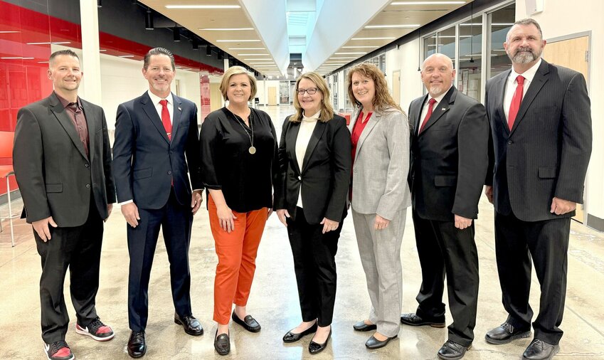 The Ozark Board of Education, from left, Guy Callaway, James Griffin, Amber Bryant, Sarah Adams Orr, Christina Tonsing, Mark Jenkins and Dustin Kirkman.