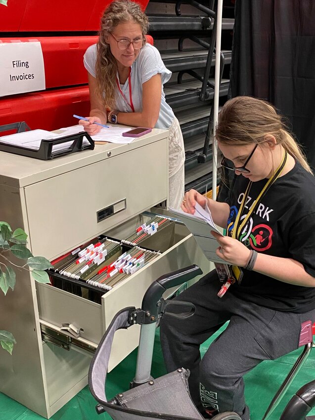 Danna Gopa files invoices during the Branson Job Olympics on March 27.
