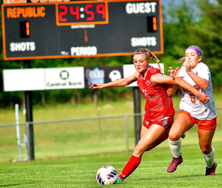 NIXA'S JADE JOHNSON beats a Republic player to the ball in the teams' match Wednesday.