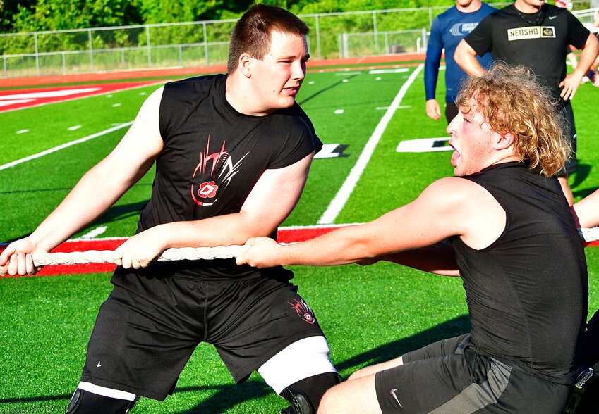 OZARK'S ETHAN JOHNSON AND RUBEN ARVIZU compete in a tug-of-war at this week's Ozark Lineman Challenge.