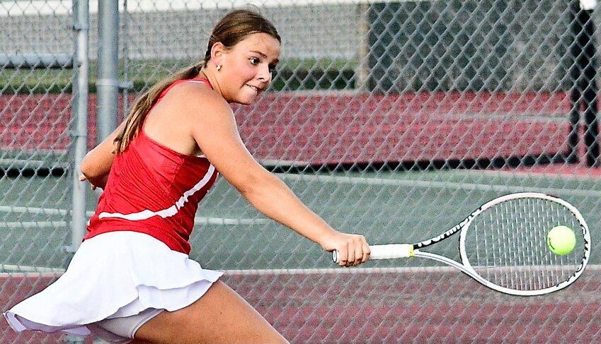 NIXA'S PAIGE MORRIS makes a backhand return versus Glendale on Wednesday.