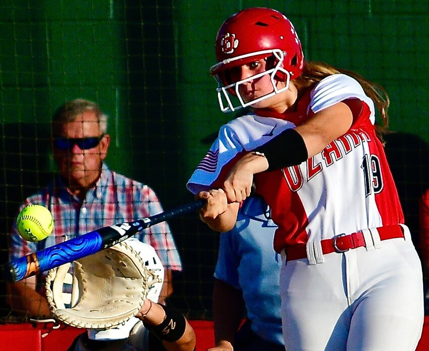 OZARK'S AUDREY CARLTON connects on a base hit.