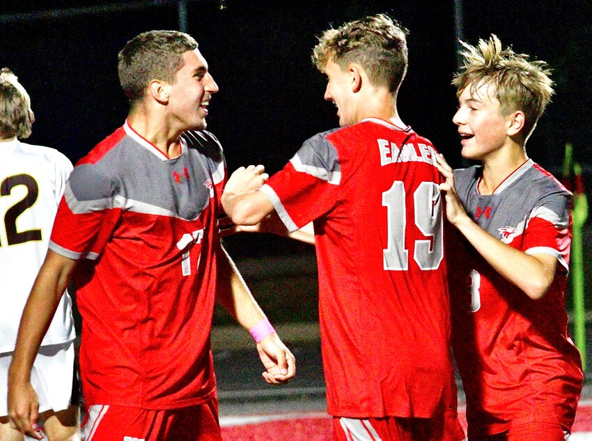 NIXA'S JAYDEN TATE celebrates a goal with teammate Spencer Rinne and Keagan Pycior last week versus Kickapoo.