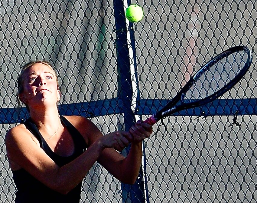 OZARK'S CLAIRE RUTLEDGE eyes a return during Class 3 District 5 action Wednesday.