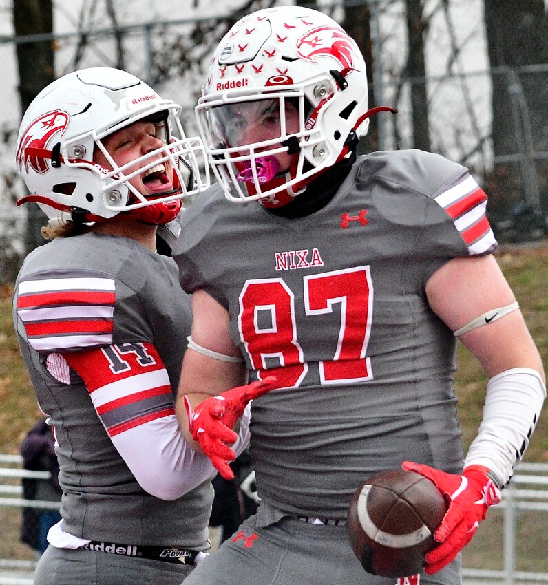 NIXA'S LANE MELTABARGER AND CHAMP PORTER celebrate a touchdown.