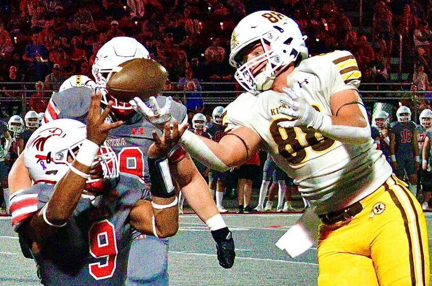 NIXA'S TOBIAS THOMPSON defends a Kickapoo pass.