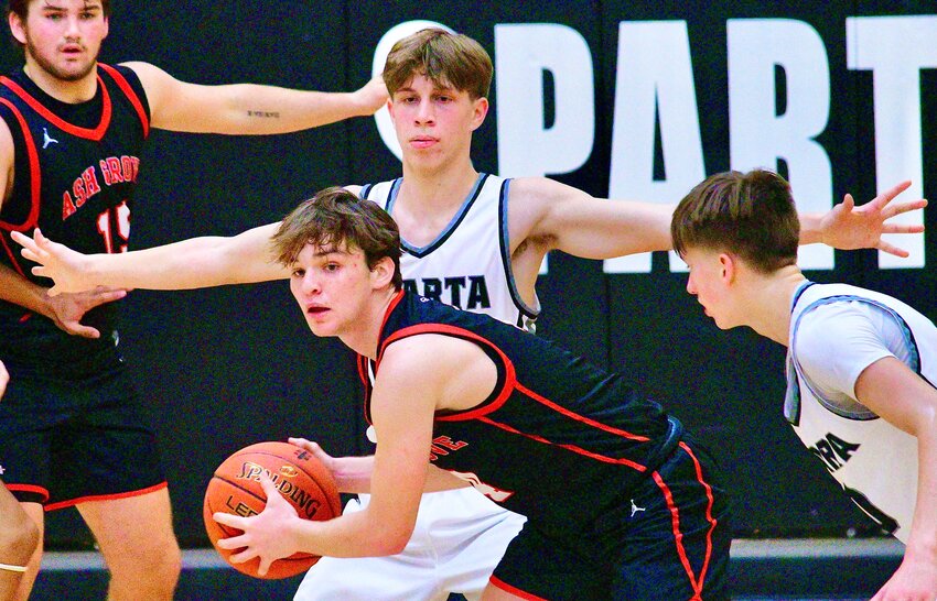 SPARTA'S BEN MILLER defends an Ash Grove ball-handler.
