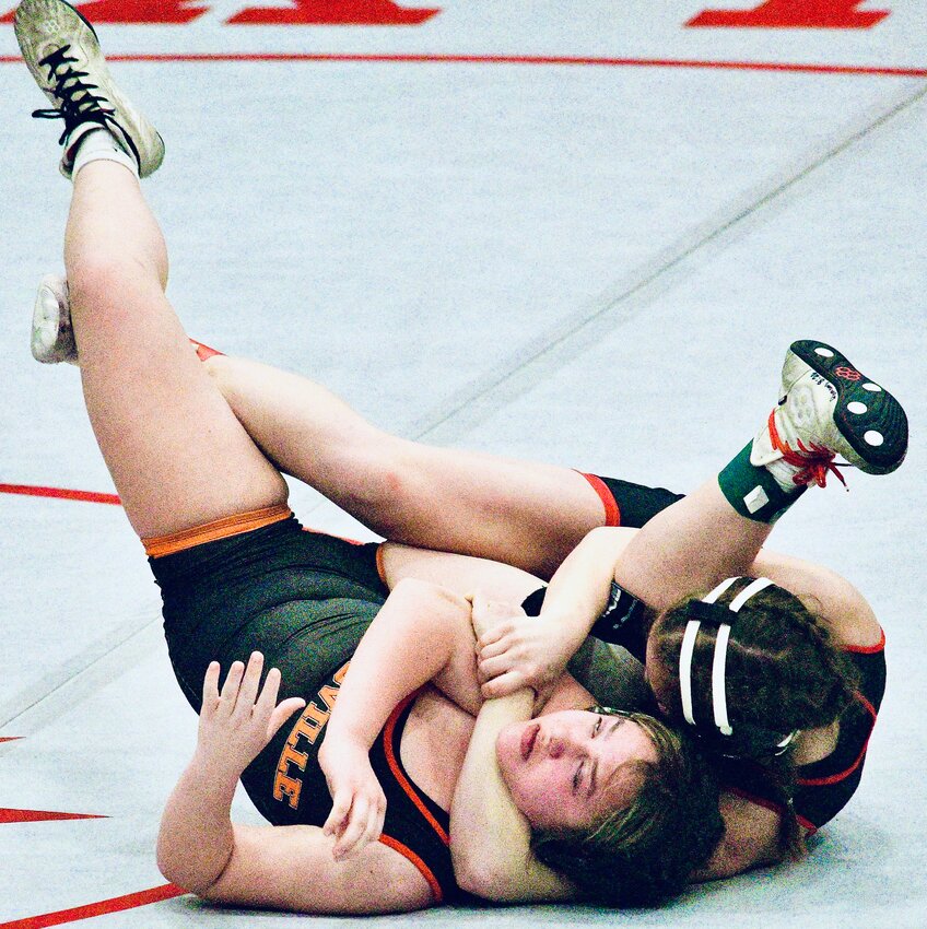 OZARK'S MAELYNN SUNDLIE sets herself up for a pin in the 135 final at the Nixa Invite.