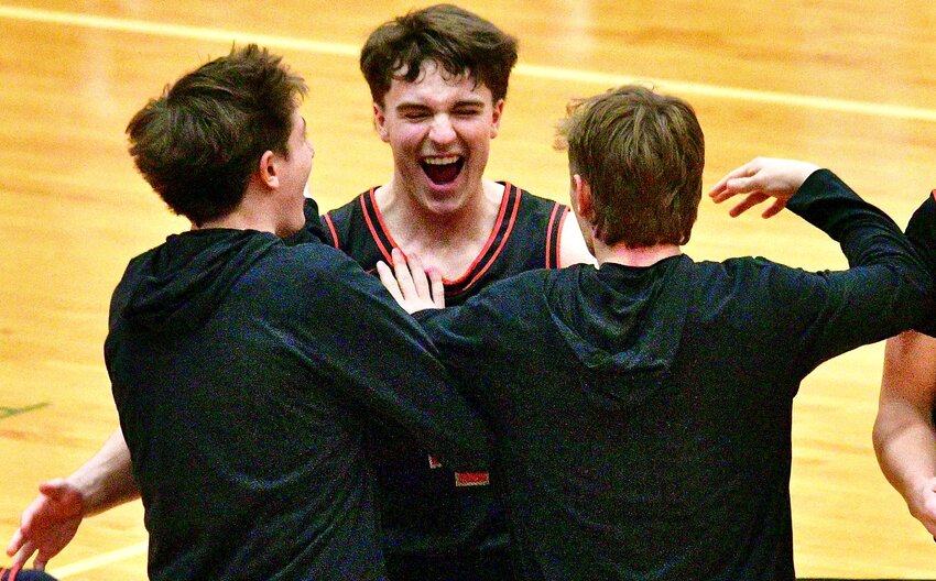 OZARK'S DREW HAYWARD receives congrats from teammates after hitting a 3-pointer.