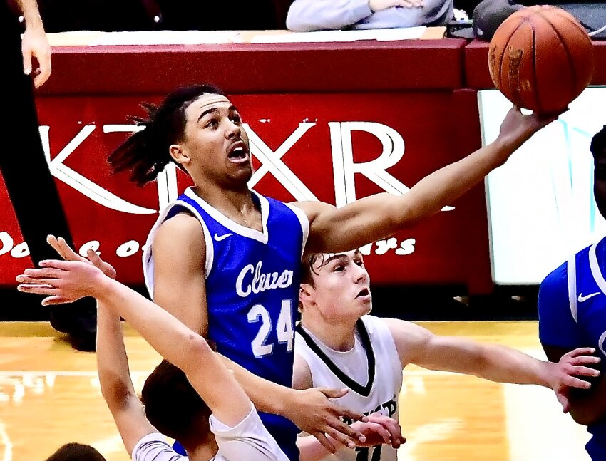CLEVER'S ELI BUSSARD soars to the hoop Monday at the Blue &amp; Gold Tournament.