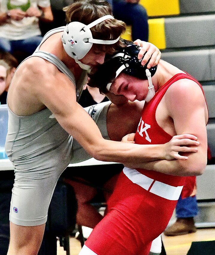OZARK'S COLTON WILSON works his way toward a win against Nixa's Jax Adams in the 132 final at the Kinloch Classic.