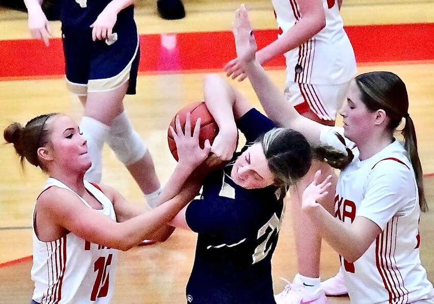 NIXA'S KARIS FERGUSON AND GWEN KUBIK pressure a Helias ball-handler Friday.