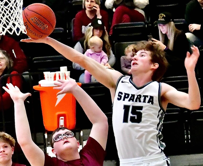 SPARTA'S BRAYLEN LUTTRULL extends his right arm on a finger-roll layup.