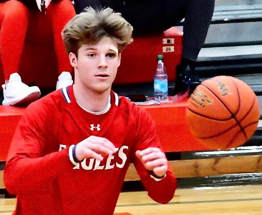 NIXA'S ADAM MCKNIGHT and the Eagles have enjoyed great success on the hardwood and gridiron in recent seasons.