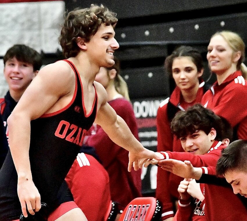 OZARK'S GRAHAM BENNETT receives congrats following a win.