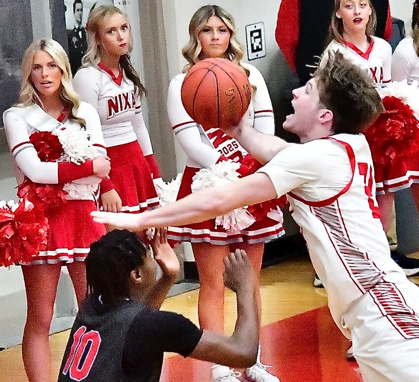 NIXA'S ADAM MCKNIGHT soars to the hoop for a layup Monday versus Glendale.