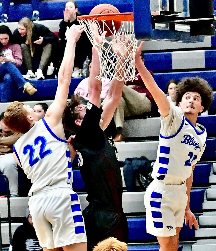CLEVER'S BRAYDEN FLOOD AND LUCAS PEEBLES contest a Strafford shot.