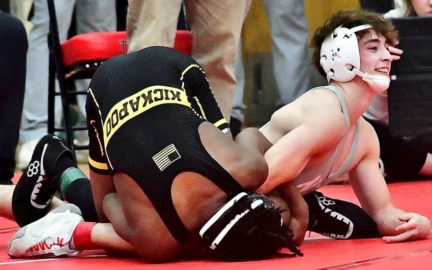 NIXA'S JAX ADAMS is all smiles at end of his District consolation semifinal win that earned him a State berth.