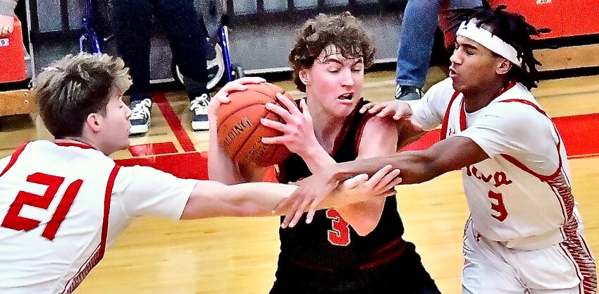 NIXA'S ADAM MCKNIGHT AND RANDY FLINT apply defensive pressure on Ozark's Jack Berryman on Tuesday.