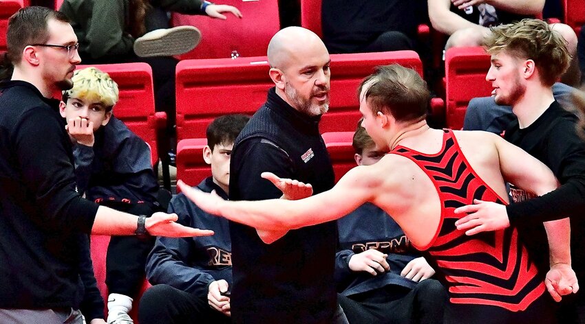 OZARK'S CADEN HARRINGTON receives congrats after winning a District championship last weekend.