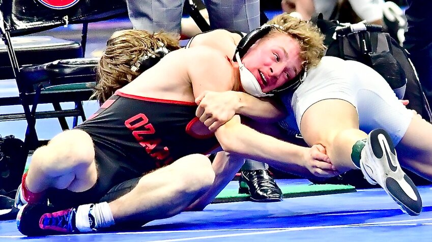 OZARK'S KEATON HURST tries to roll over his opponent.
