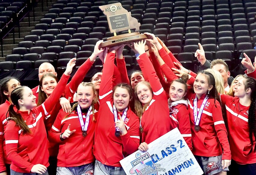 NIXA'S GIRLS WRESTLING TEAM celebrates its Class 2 state championship.