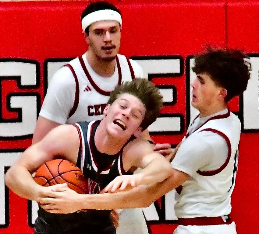 NIXA'S ADAM MCKNIGHT posts up in the paint.