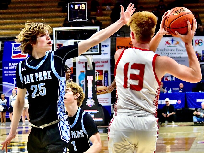 NIXA'S TY KELLIS looks for room around an Oak Park defender.